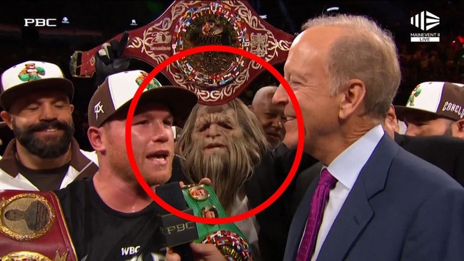 A bizarre character held the belt after Canelo's victory.