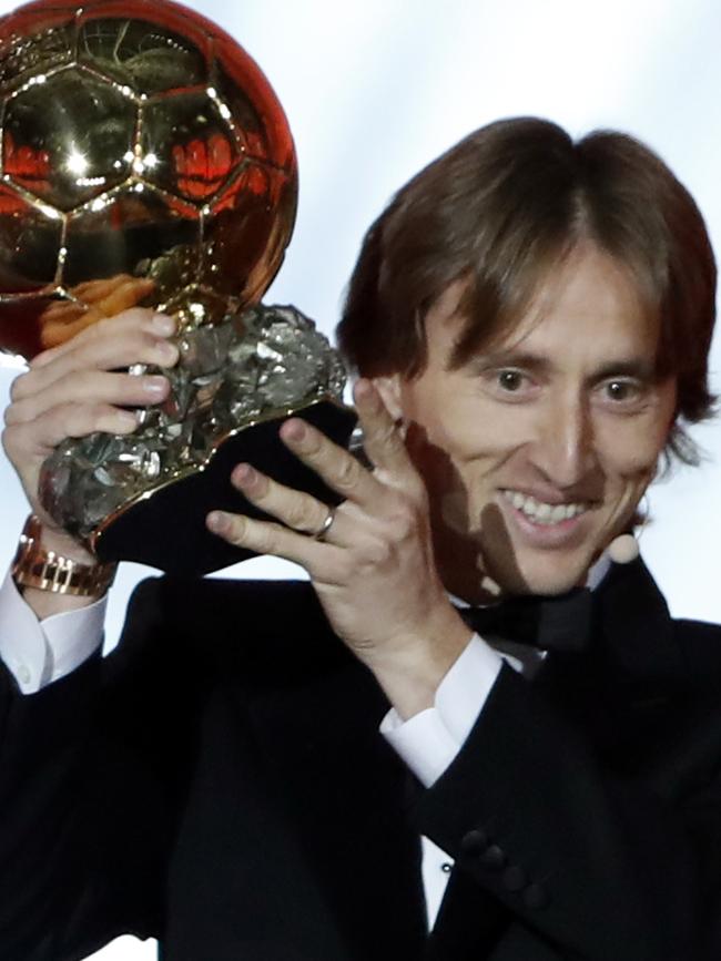 Real Madrid's Luka Modric celebrates with the Ballon d'Or award. Picture: AP