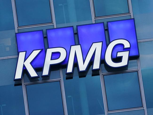 BERLIN, GERMANY - JANUARY 22: The logo of KPMG, a multinational tax advisory and accounting services company, hangs on the facade of a KPMG offices building on January 22, 2021 in Berlin, Germany. KPMG has come under the spotlight in Germany due to the company's role in the current Wirecard scandal.  (Photo by Sean Gallup/Getty Images)