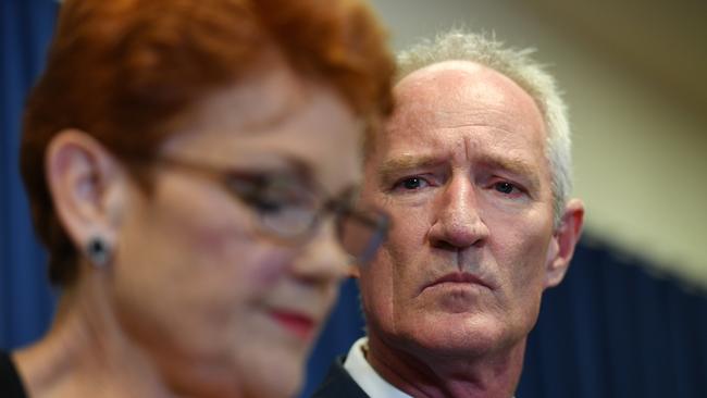 Queensland Senator and One Nation leader Pauline Hanson (left), is watched by Steve Dickson, during a press conference in March.