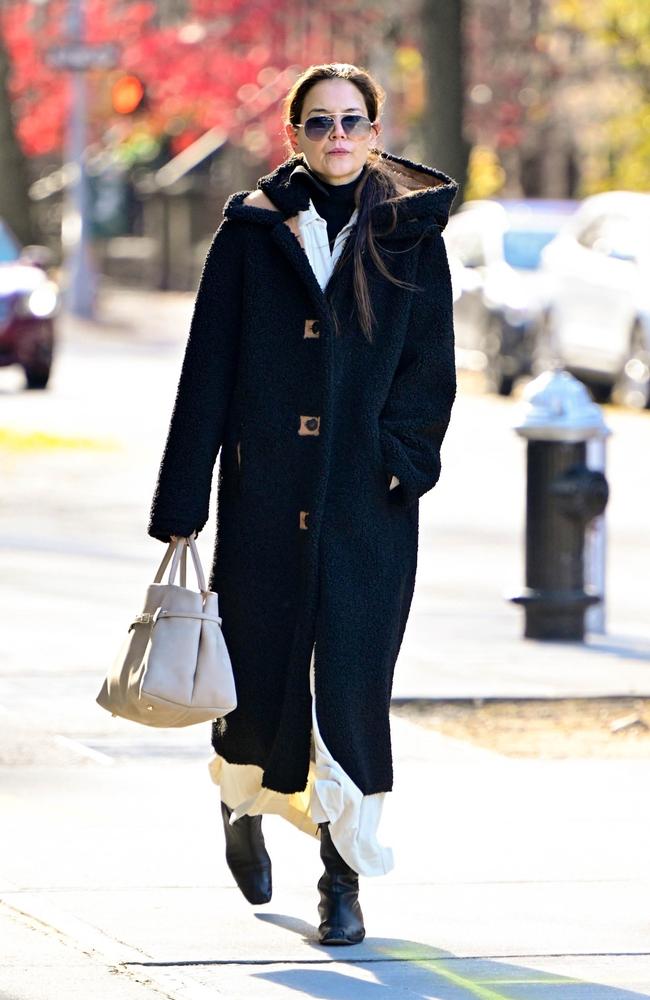 A rugged up Katie Holmes stayed warm in a massive coat as she got out and about in New York City. Picture: Diamond/Backgrid