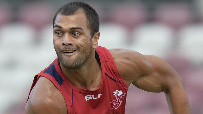 BRISBANE, AUSTRALIA - JANUARY 29: Karmichael Hunt passes the ball during a Queensland Reds Super Rugby training session on January 29, 2015 in Brisbane, Australia. (Photo by Bradley Kanaris/Getty Images)