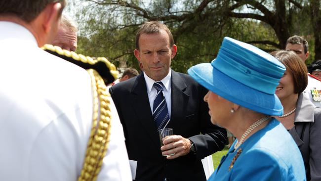 Queen Elizabeth II with Tony Abbott at the presentation of the Queens Colours at Royal Military College Duntroon in Canberra in 2011.