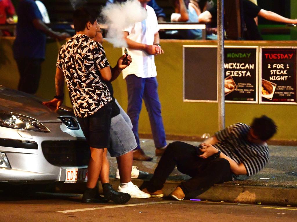 GOING: A young New Year's Eve reveller topples to the ground as his mates look on in the early hours of New Year's day