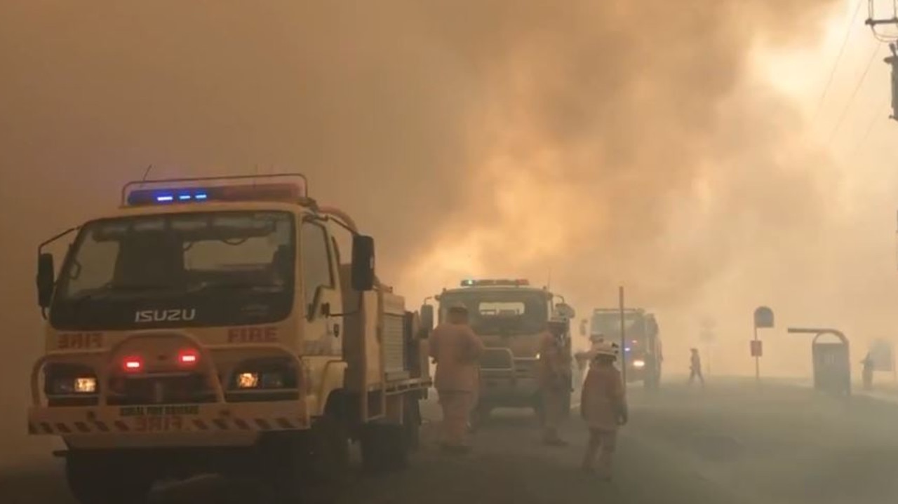 Fire crews at the scene of a bushfire at Peregian Beach this morning. Picture: Lachie Millard