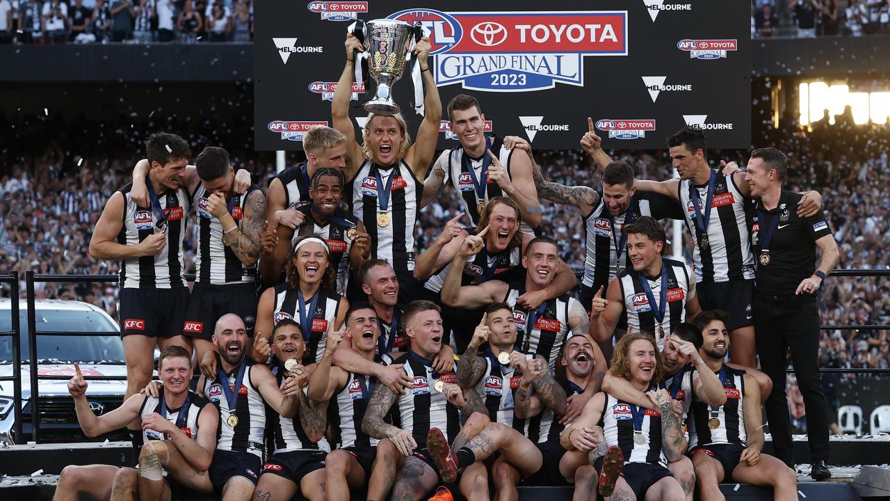 Collingwood team on the dias after receiving their medals and the Premiership Cup. Picture: Michael Klein