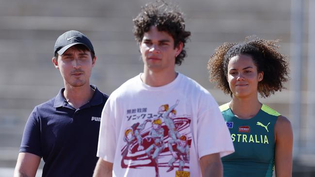 Torrie Lewis, right, and Caleb Law with their coach Andrew Iselin. Pic: Michael Klein