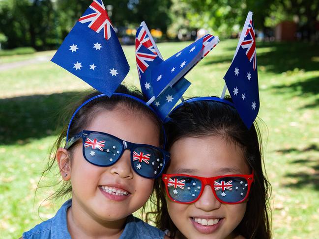 After the Australia Day march people gathered at Domain gardens in Melbourne. Sisters, Ella,6 and Chloe,10 loved watching the parade, Chloe along with her family arrived in Australia 9 years ago. Picture: Sarah Matray