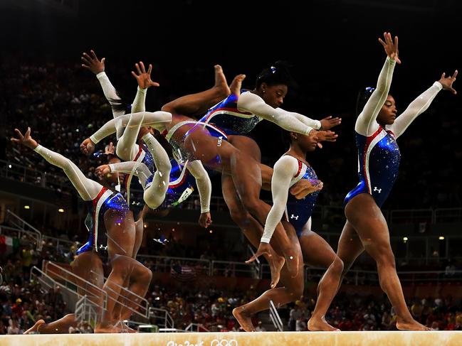 RIO DE JANEIRO, BRAZIL - AUGUST 11: (EDITORS NOTE: Multiple exposures were combined in camera to produce this image.) Simone Biles of the United States competes on the balance beam during the Women's Individual All Around Final on Day 6 of the 2016 Rio Olympics at Rio Olympic Arena on August 11, 2016 in Rio de Janeiro, Brazil. (Photo by Mike Ehrmann/Getty Images)