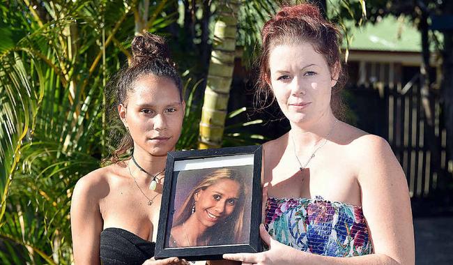 UNANSWERED QUESTIONS: Minnie Clubb and Nikki Duncan with photos of their sister and sister-in-law Monique Clubb, who went missing two years ago. Picture: Alistair Brightman