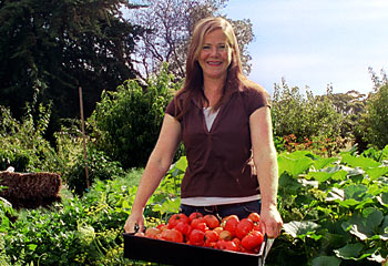 Home-grown ... Hill of Content owner, Fiona Cody in her vegetable garden. Picture: Mike Smith