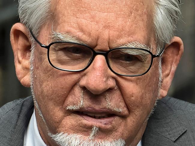 (FILES) This file photo taken on July 04, 2014 shows veteran entertainer Rolf Harris arriving at Southwark Crown Court in London on July 4, 2014. Harris groped several women and girls in public, including a blind and disabled victim, prosecutors told a London court at the start of his trial on January 11, 2017. The former television star, 86, is accused of seven counts of indecent assault and one of sexual assault which allegedly took place between 1971 and 2003. / AFP PHOTO / Niklas HALLE'N