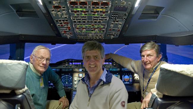 Neil Armstrong (left), Qantas pilot Richard de Crespigny (centre) and his father Peter de Crespigny in the A380 simulator as Sydney Airport.