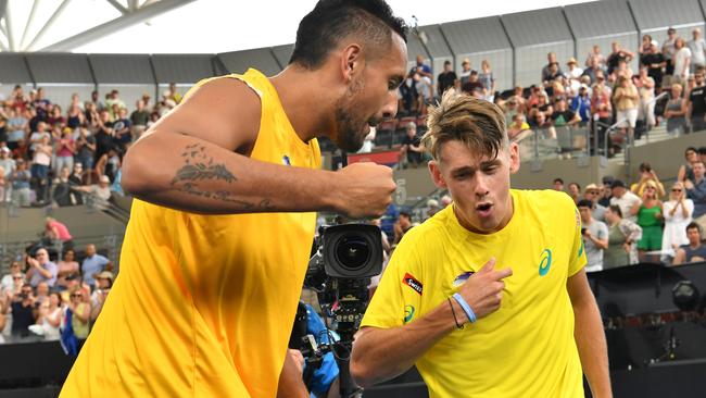 De Minaur celebrates his win with Nick Kyrgios.