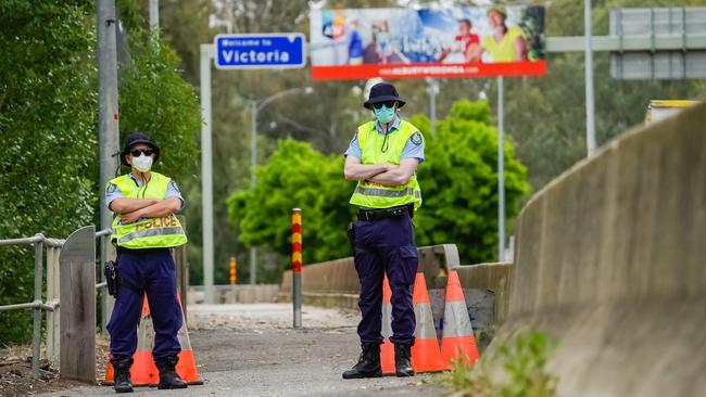 Police patrol the Albury Border Check point in Wodonga Place. Picture: Simon Dallinger