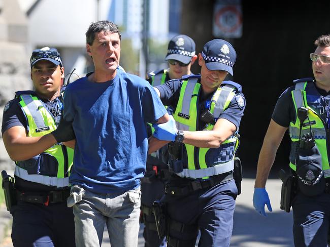 The man is arrested under the Princes Bridge in Melbourne. Picture: Alex Coppel.