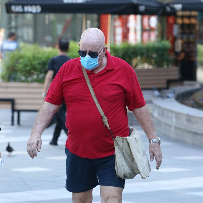 Surfers Paradise resident George Carr, 76, takes precautions. Picture: Glenn Hampson