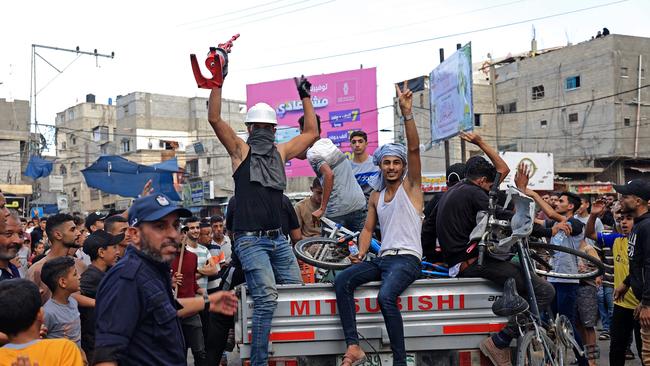 Palestinians celebrate their return after crossing the border fence with Israel. Picture: AFP