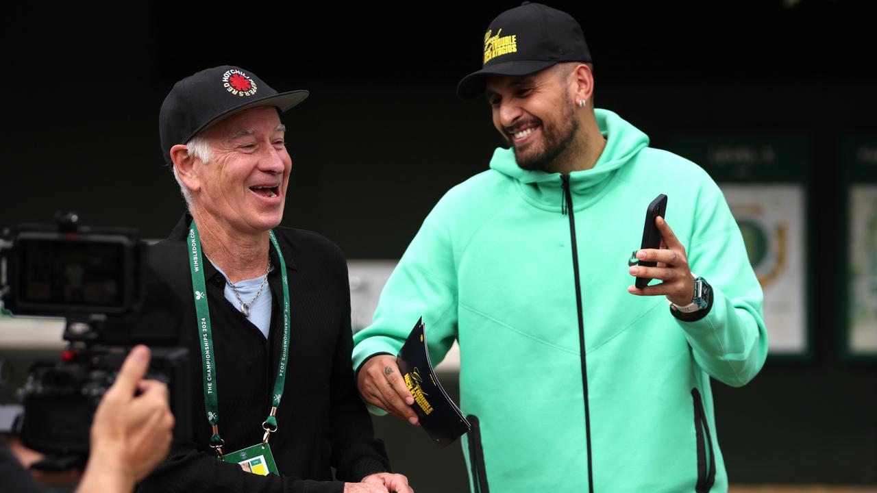 John McEnroe has a laugh with Kyrgios at Wimbledon. (Photo by Clive Brunskill/Getty Images)