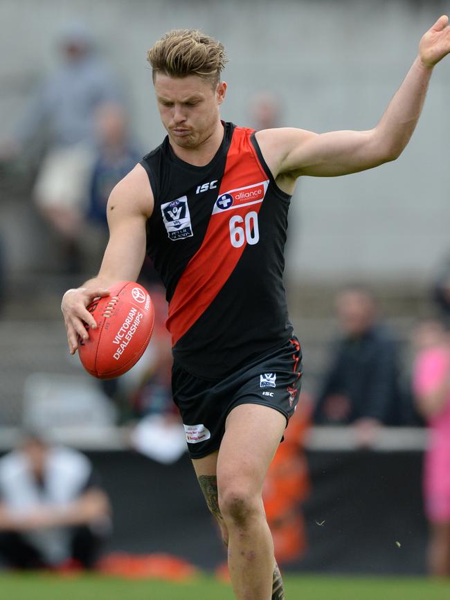 Ben Fennell gets a kick away for Essendon VFL. Picture: AAP/ Chris Eastman