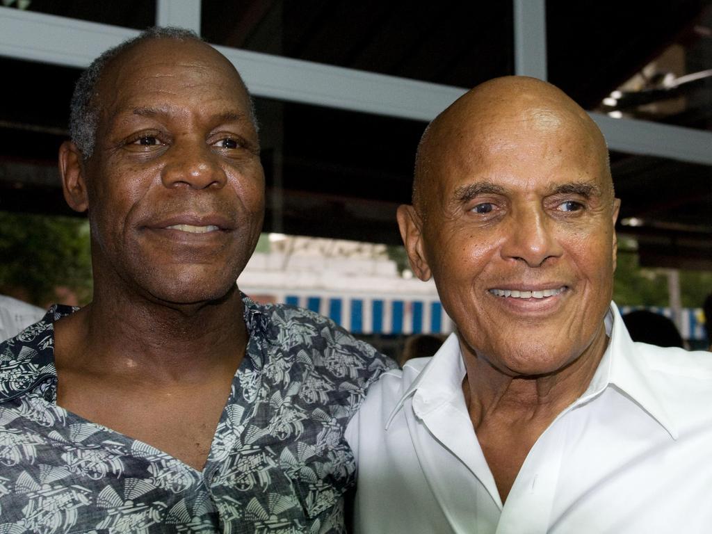 US actors Danny Glover and Harry Belafonte pose in Havana, during the opening of a Caribbean cinema exhibition in 2009.