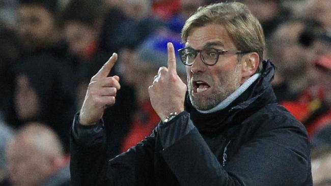 Liverpool's German manager Jurgen Klopp gestures from the touchline during the English Premier League football match between Liverpool and West Ham United at Anfield in Liverpool, north west England on December 11, 2016. / AFP PHOTO / Lindsey PARNABY / RESTRICTED TO EDITORIAL USE. No use with unauthorized audio, video, data, fixture lists, club/league logos or 'live' services. Online in-match use limited to 75 images, no video emulation. No use in betting, games or single club/league/player publications. /