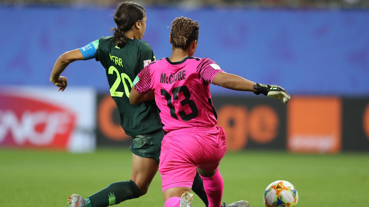 Sam Kerr scores past Nicole McClure.