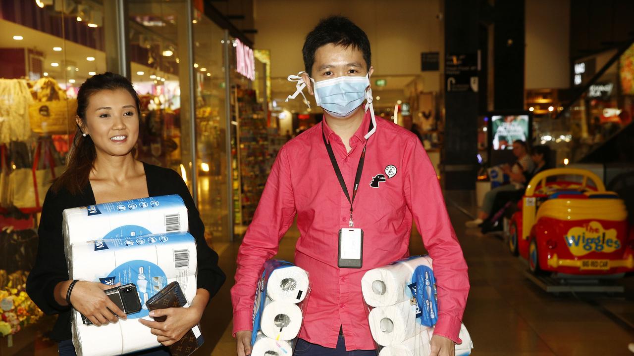 L to R: Fiona Leung and Cyrus San stock up on Toilet paper. Macquarie Centre in the same geographic area as recent cases of Corona viruses has surfaced. Are people being more cautious? Picture: John Appleyard