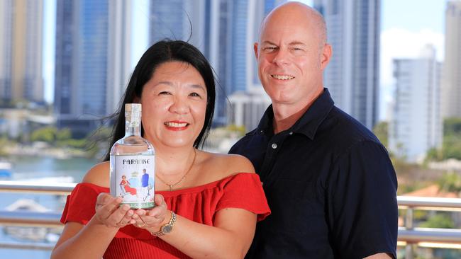 Gold Coast entrepreneurs and locals Debby Lo-Dean and husband Conrad Dean have created a unique Surfers Paradise-inspired gin using a secret ingredient Photo: Scott Powick