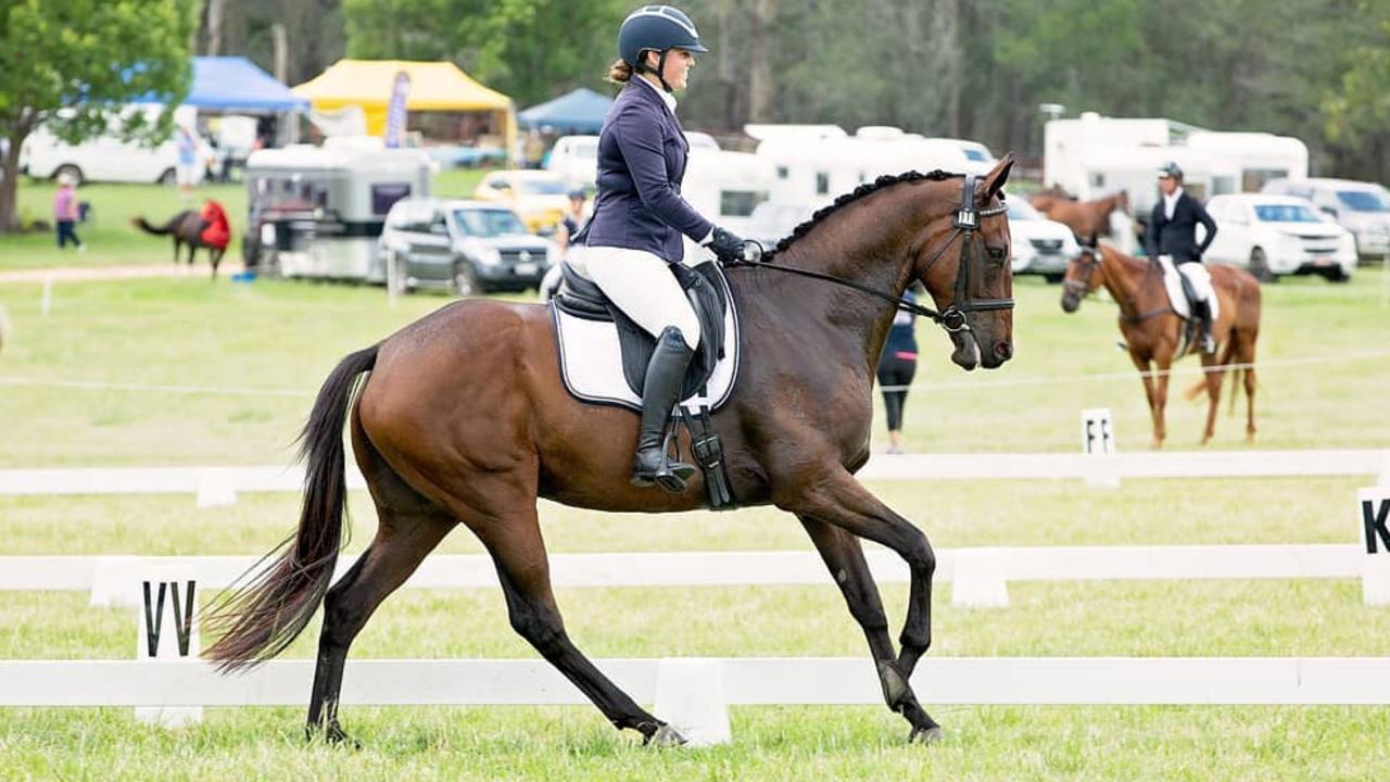 Georgia Barnett guides Big Biscuit around the dressage arena.