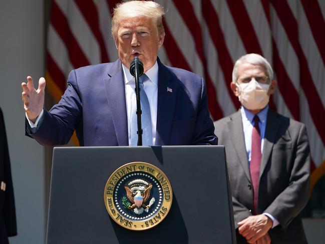 (FILES) In this file photo taken on May 15, 2020 US President Donald Trump, with Response coordinator for White House Coronavirus Task Force Deborah Birx (L) and Director of the National Institute of Allergy and Infectious Diseases Anthony Fauci (R), speaks on vaccine development in the Rose Garden of the White House in Washington, DC. - President Donald Trump has tested positive for Covid-19, upending the already chaotic US election, but was described by his doctor on October 2, 2020 as feeling "well" and able to perform his duties while quarantining. (Photo by MANDEL NGAN / AFP)