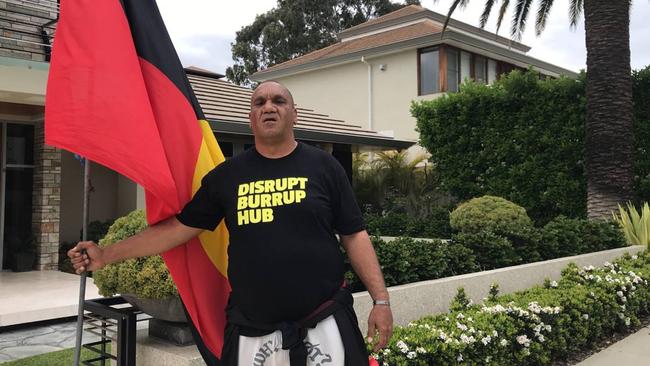 Desmond Blurton protests outside the home of Woodside and Rio Tinto director Ben Wyatt.