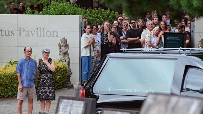 Mr Wong’s mother watches as his coffin is taken away. Picture: NewsWire / Flavio Brancaleone