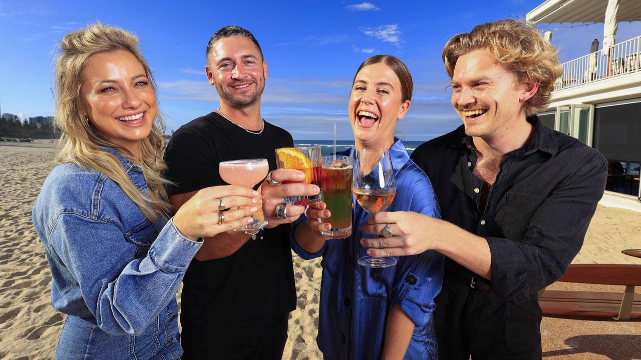 Romy Poulier, Nick Woodward, Harriet Stratford, and Jack Hutchison enjoy a drink at Rick Shores, Burleigh Heads. Picture: Adam Head