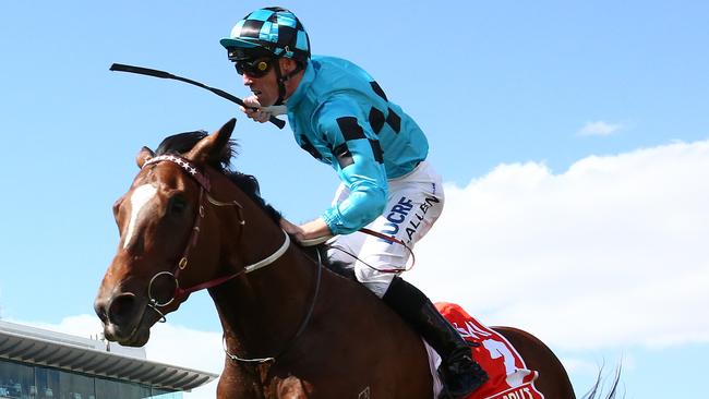 John Allen celebrates after Extra Brut storms to victory in the Victoria Derby. Picture: Getty Images