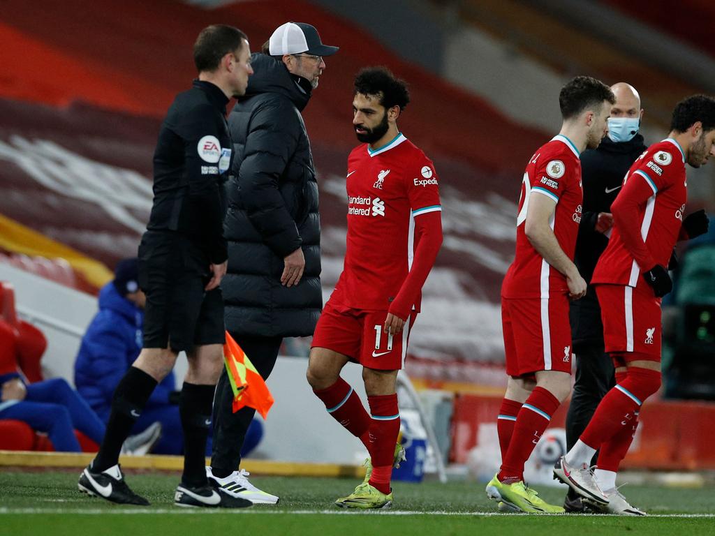 Liverpool's Egyptian midfielder Mohamed Salah (centre) leaves the pitch after being substituted. (Photo by PHIL NOBLE / POOL / AFP)