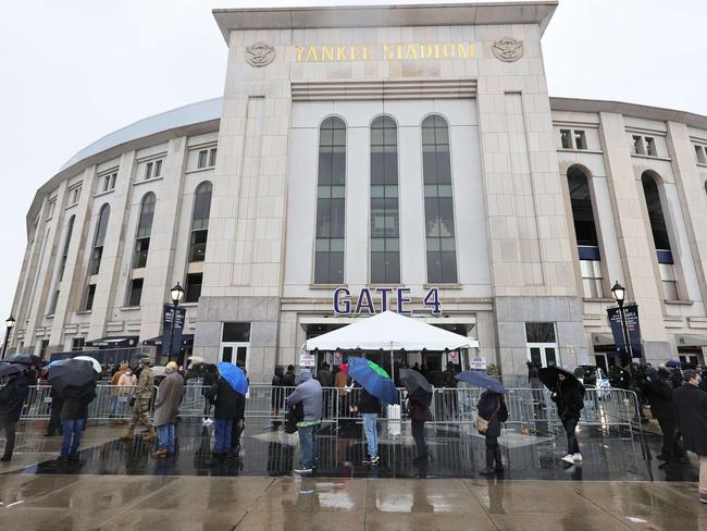 People wait in line to enter the coronavirus vaccination site at Yankee Stadium in the Bronx borough of New York City. Picture: Getty Images/AFP