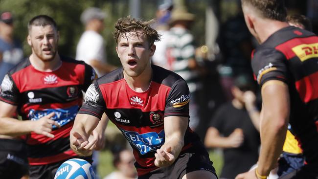 Norths Jack Lindsay gets the pass away against Warringah.