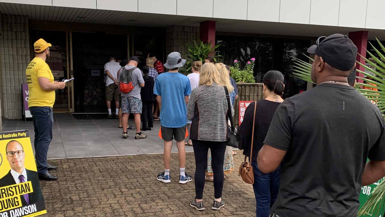 Voters line up at the Mercury House booth in Mackay on the first day of early voting for the 2022 federal election. Picture: Duncan Evans