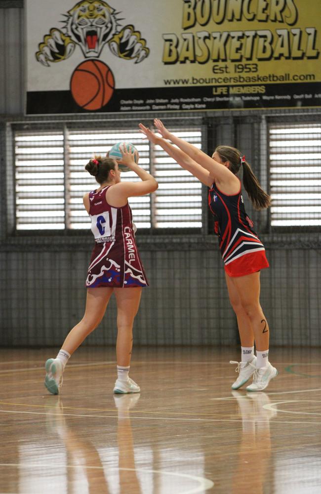 Netball action from QISSN 2024 in Townsville. Carmel College v Shalom College