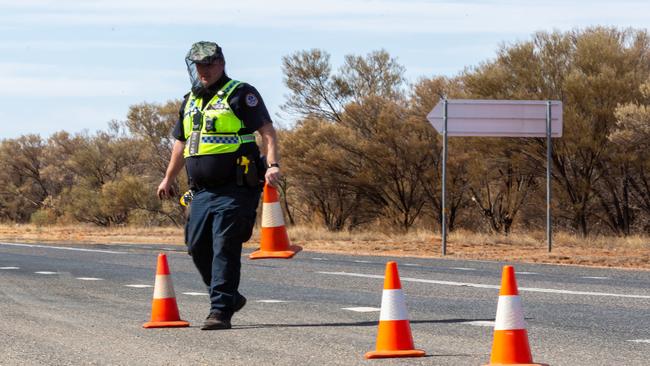 Police prepare to close the NT/SA border on Tuesday. Photo: Emma Murray