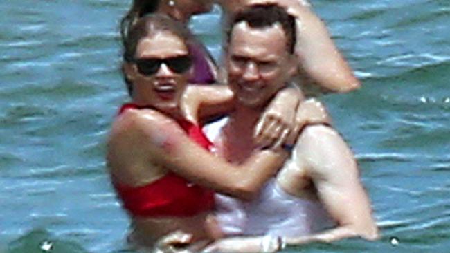Taylor cuddles up with Tom as her slew of celeb pals look on. Picture: Ryan Turgeon/Splash News