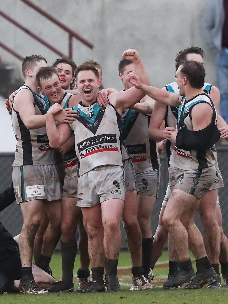 Patrick Kelly with Cygnet team mates celebrating the win. Huonville Lions V Cygnet seniors. SFL grand finals at North Hobart Oval. Picture: Nikki Davis-Jones