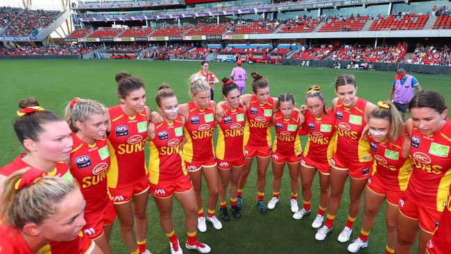 Suns huddle during the round 2 AFLW match between the Gold Coast Suns and the Richmond Tigers at Metricon Stadium on February 15, 2020 in Gold Coast, Australia. (Photo by Chris Hyde/AFL Photos/Getty Images)