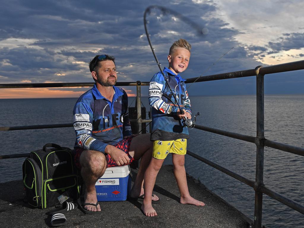 Levi Nash, 40 of Glengowrie with his son Sullivan, 7, fishing off the Glenelg Jetty. Picture: Tom Huntley