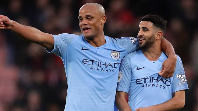 Vincent Kompany celebrates with teammate Riyad Mahrez. Picture: Getty Images