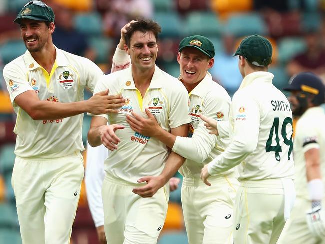 New Australian captain Pat Cummins celebrates with teammates after dismissing Chris Woakes in the Ashes opener of 2021. Picture: Chris Hyde/Getty Images