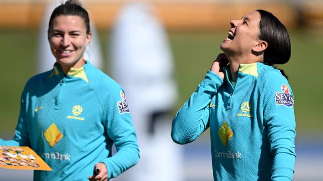 Steph Catley and Sam Kerr are all smiles at Matildas training in Brisbane. Picture: Bradley Kanaris/Getty Images