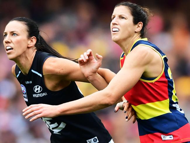 ADELAIDE, AUSTRALIA - MARCH 31: Alison Downie of Carlton   competes with Jessica Foley of the Adelaide Crows during the AFLW Grand Final match between the Adelaide Crows and the Carlton Blues at Adelaide Oval on March 31, 2019 in Adelaide, Australia. (Photo by Mark Brake/Getty Images)