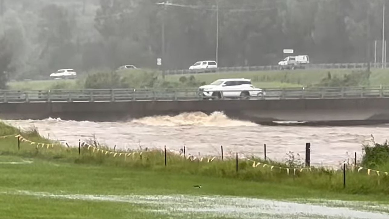 Water lapping at the edge of John Muntz Bridge in Oxenford at 3pm on Sunday. Picture: Mark Boothman MP / Facebook